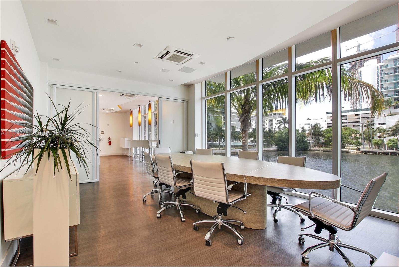 601 Northeast 27th Street, Unit 1604 Miami, FL 33137 - Photo 29 of 47 a dining room with furniture water view and a floor to ceiling window