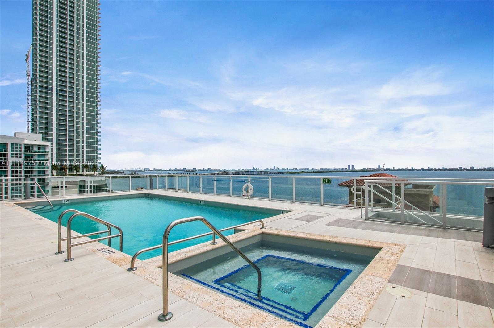 601 Northeast 27th Street, Unit 1604 Miami, FL 33137 - Photo 43 of 47 a view of a swimming pool with a lounge chairs