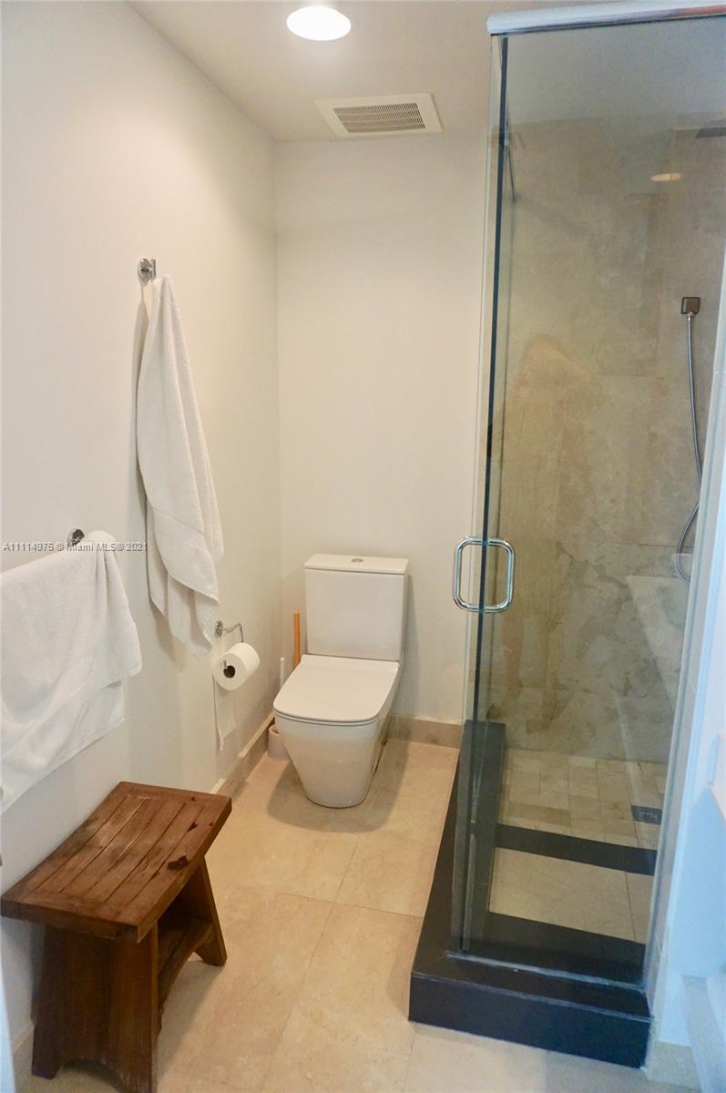 601 Northeast 27th Street, Unit 1604 Miami, FL 33137 - Photo 10 of 47 a bathroom with a toilet and a shower