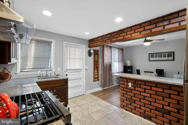 a room with furniture a window and flat screen tv