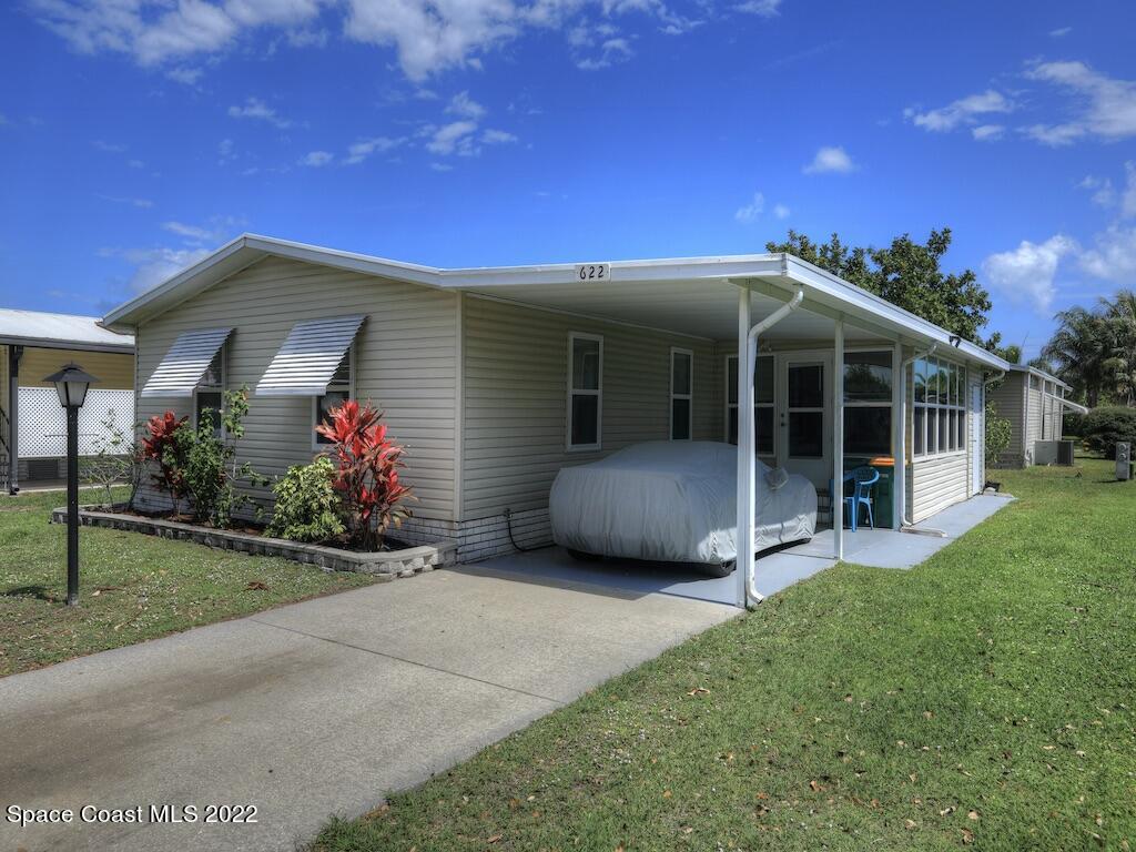622 Wedelia Drive Sebastian, FL 32976 - Photo 1 of 29 a view of a house with a yard