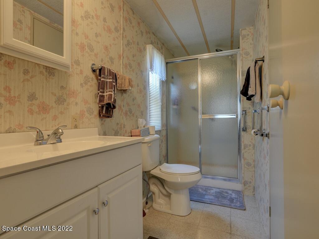 622 Wedelia Drive Sebastian, FL 32976 - Photo 22 of 29 a bathroom with a sink toilet and shower