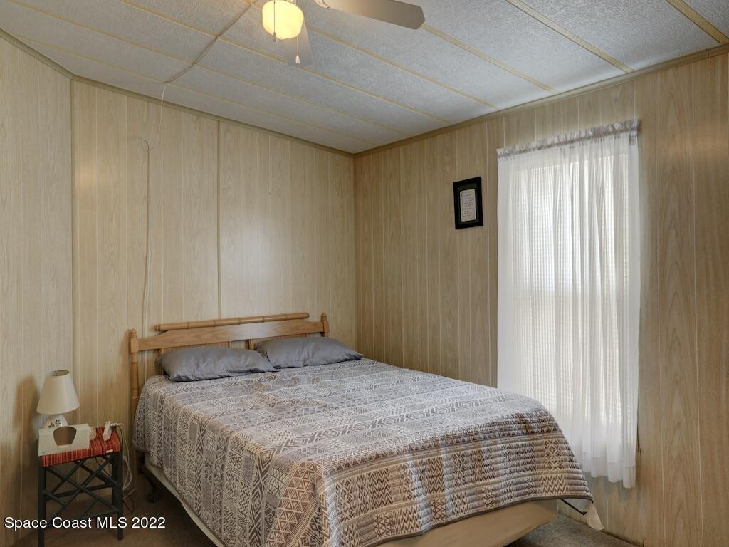 622 Wedelia Drive Sebastian, FL 32976 - Photo 23 of 29 a bedroom with a bed and a window