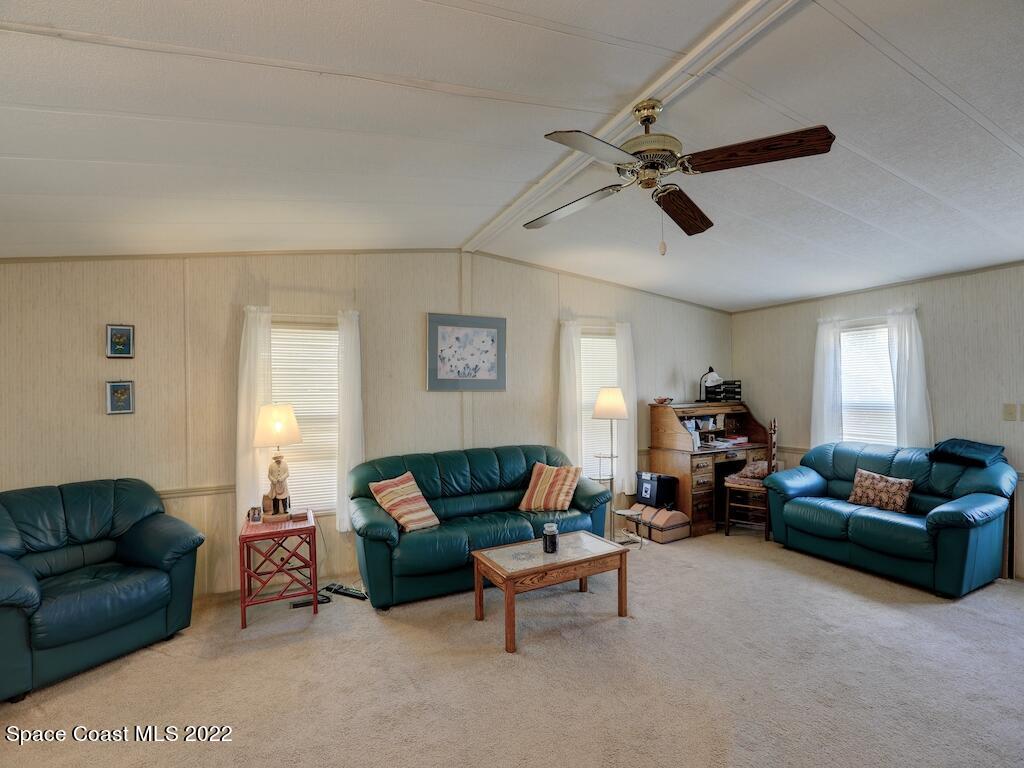 622 Wedelia Drive Sebastian, FL 32976 - Photo 9 of 29 a living room with furniture and a window