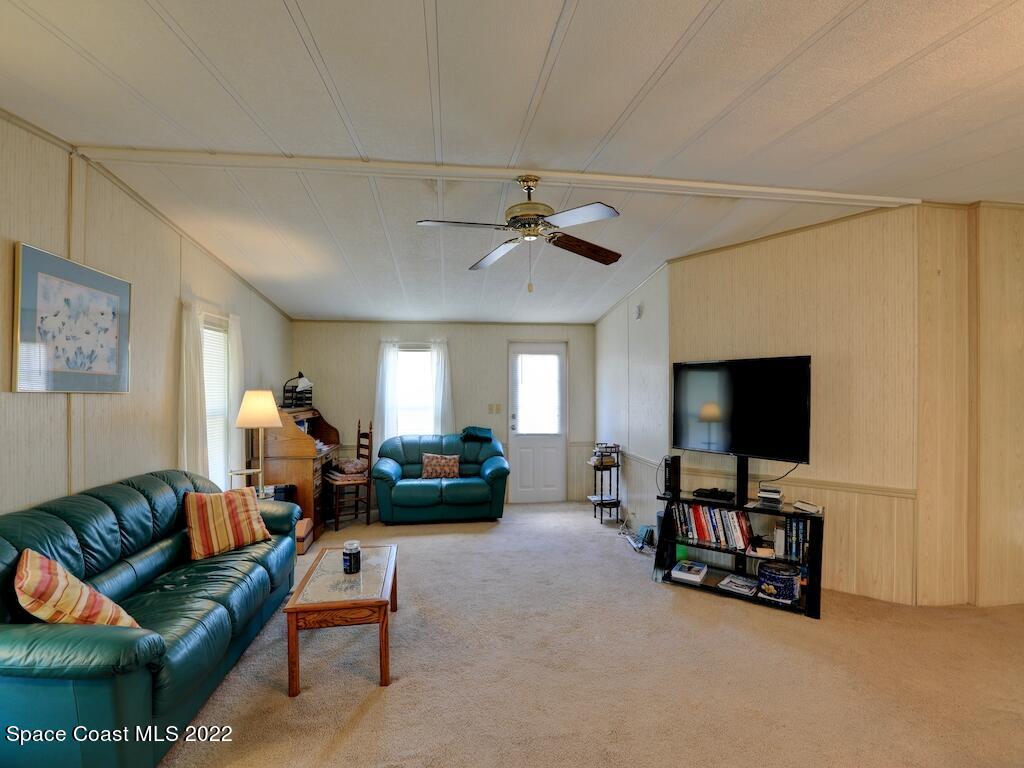622 Wedelia Drive Sebastian, FL 32976 - Photo 10 of 29 a living room with furniture and a flat screen tv
