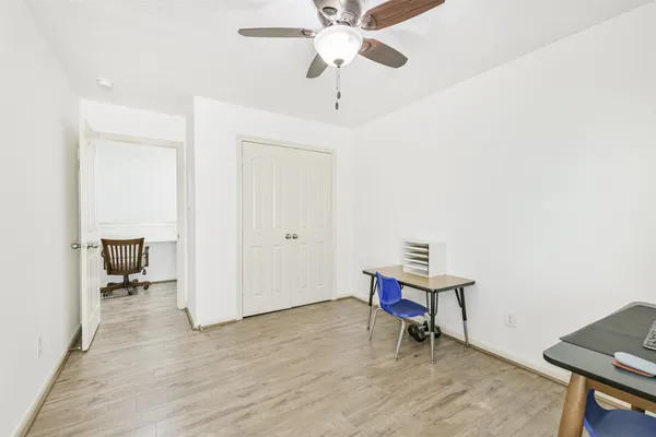 a room with furniture and wooden floor