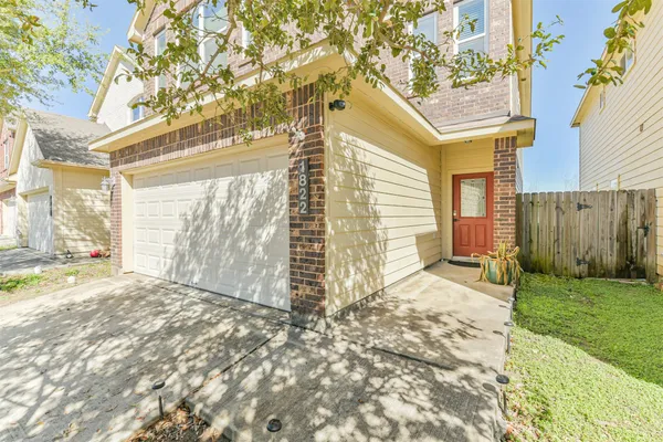 a view of a backyard of the house