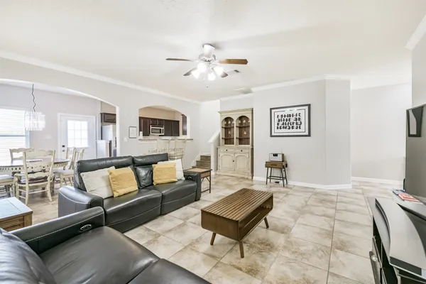 a living room with furniture and a rug