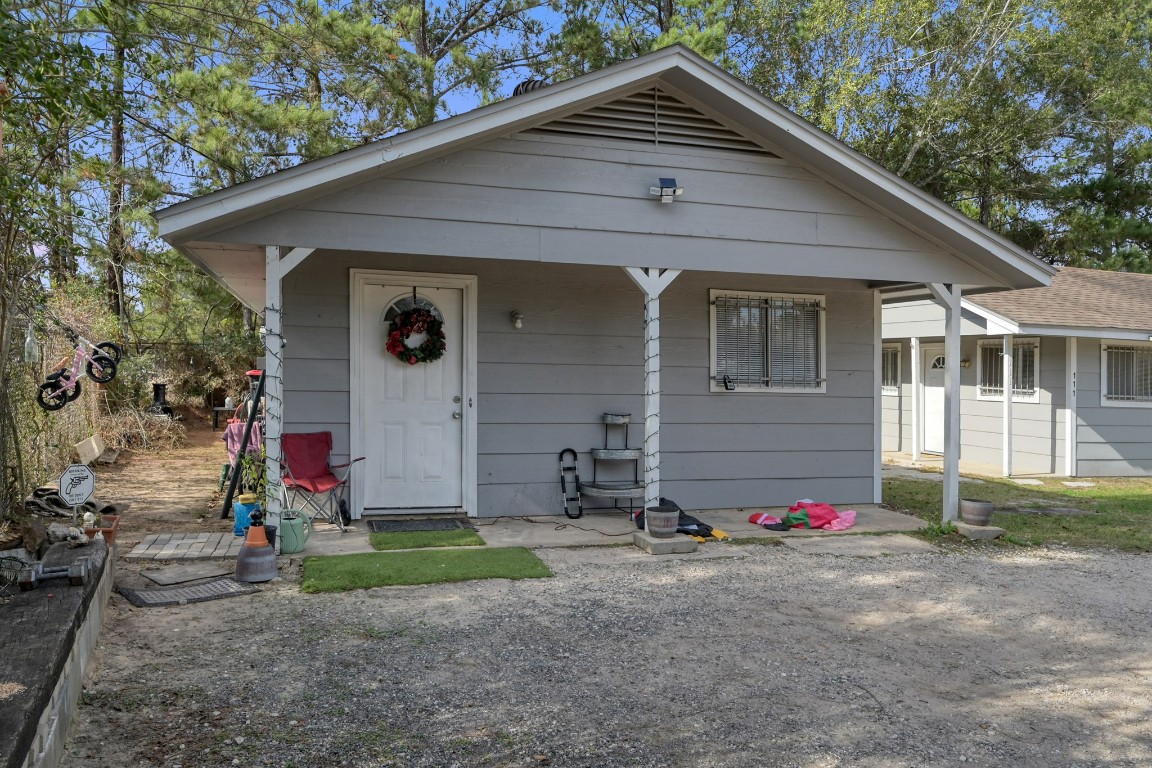 113 Cartwright Road Conroe, TX 77301 - Photo 12 of 15 a front view of a house with yard