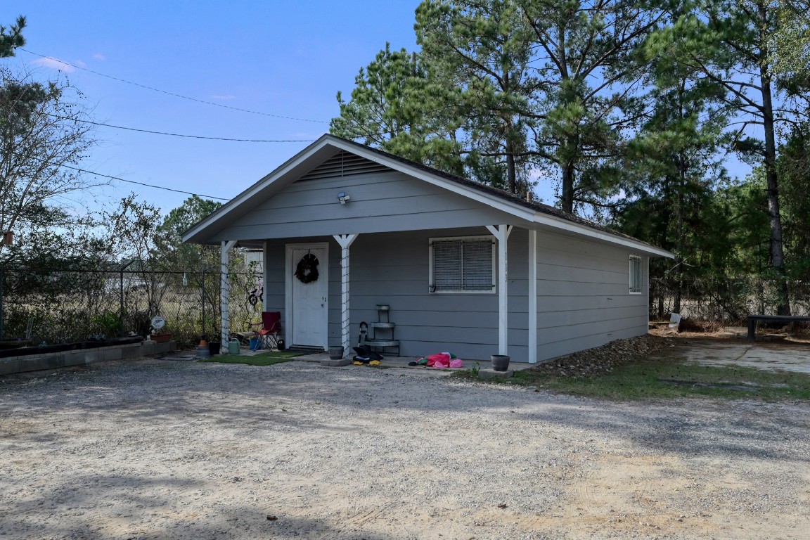 113 Cartwright Road Conroe, TX 77301 - Photo 14 of 15 a front view of a house with a yard