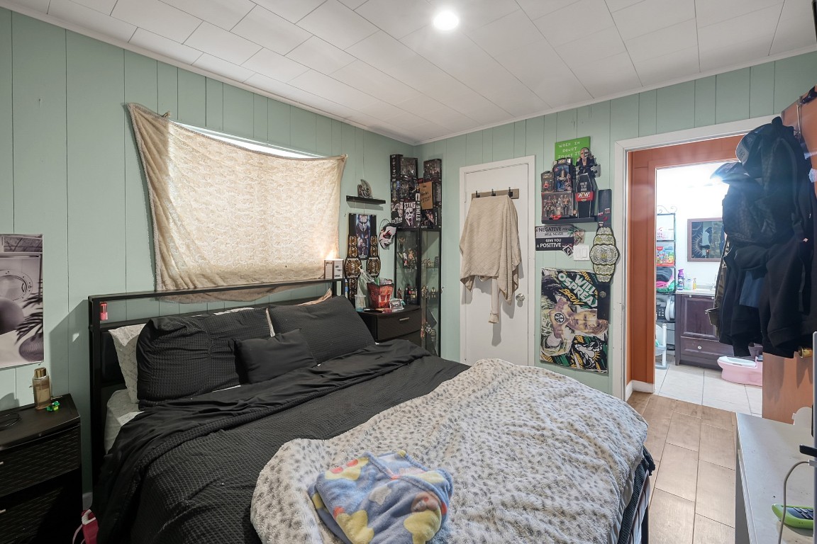 113 Cartwright Road Conroe, TX 77301 - Photo 5 of 15 a bedroom with a bed and a flat screen tv