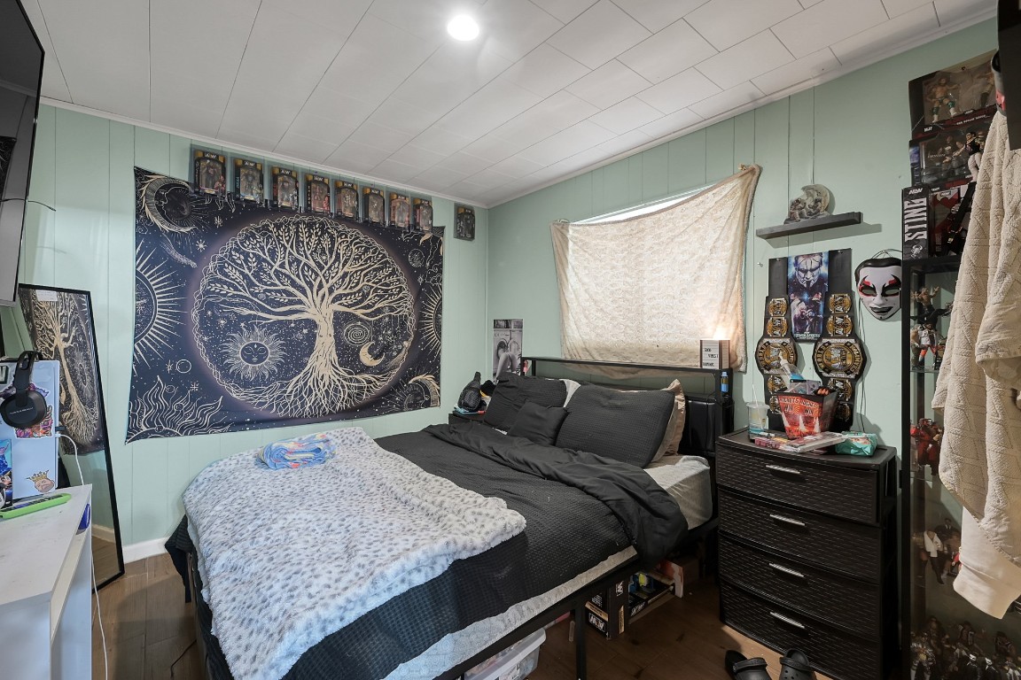 113 Cartwright Road Conroe, TX 77301 - Photo 10 of 15 a bedroom with a bed and dresser