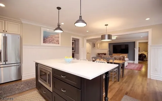 a kitchen with a refrigerator a sink and a stove