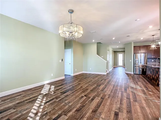 a bathroom with a double vanity sink toilet and a mirror