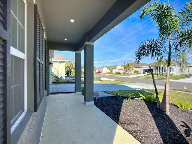an empty room with closet and wooden floor