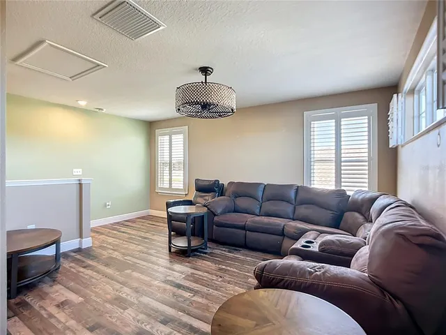 a bathroom with a sink a mirror and shower