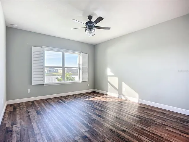 an aerial view of residential house with wooden fence
