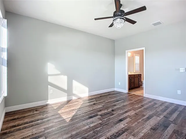 a view of a house with a yard and plants