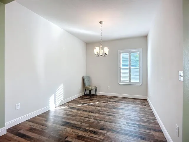 a kitchen with stainless steel appliances granite countertop a sink a stove a counter space and cabinets