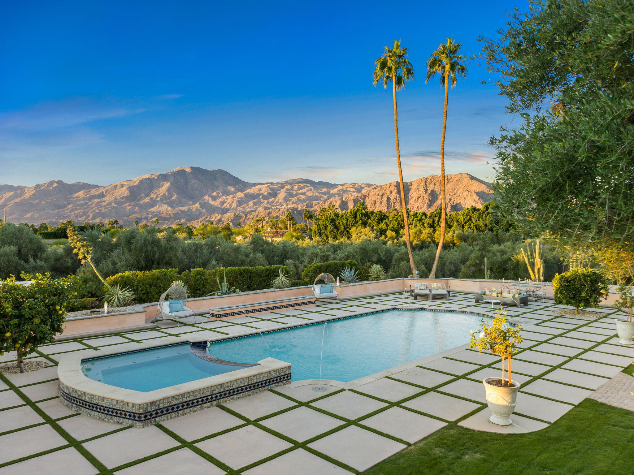 a view of a swimming pool with a lounge chairs