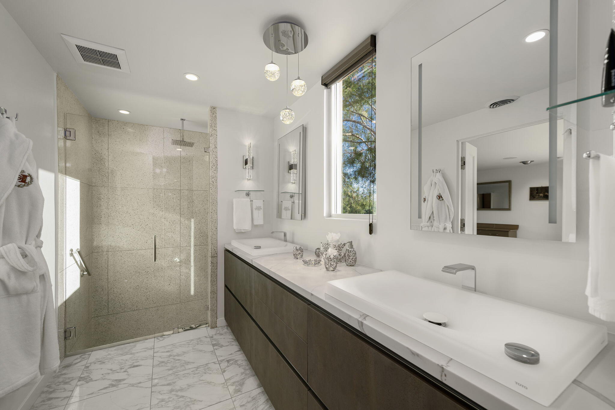 51555 Madison Street La Quinta, CA 92253 - Photo 15 of 25 a bathroom with a double vanity sink mirror and shower