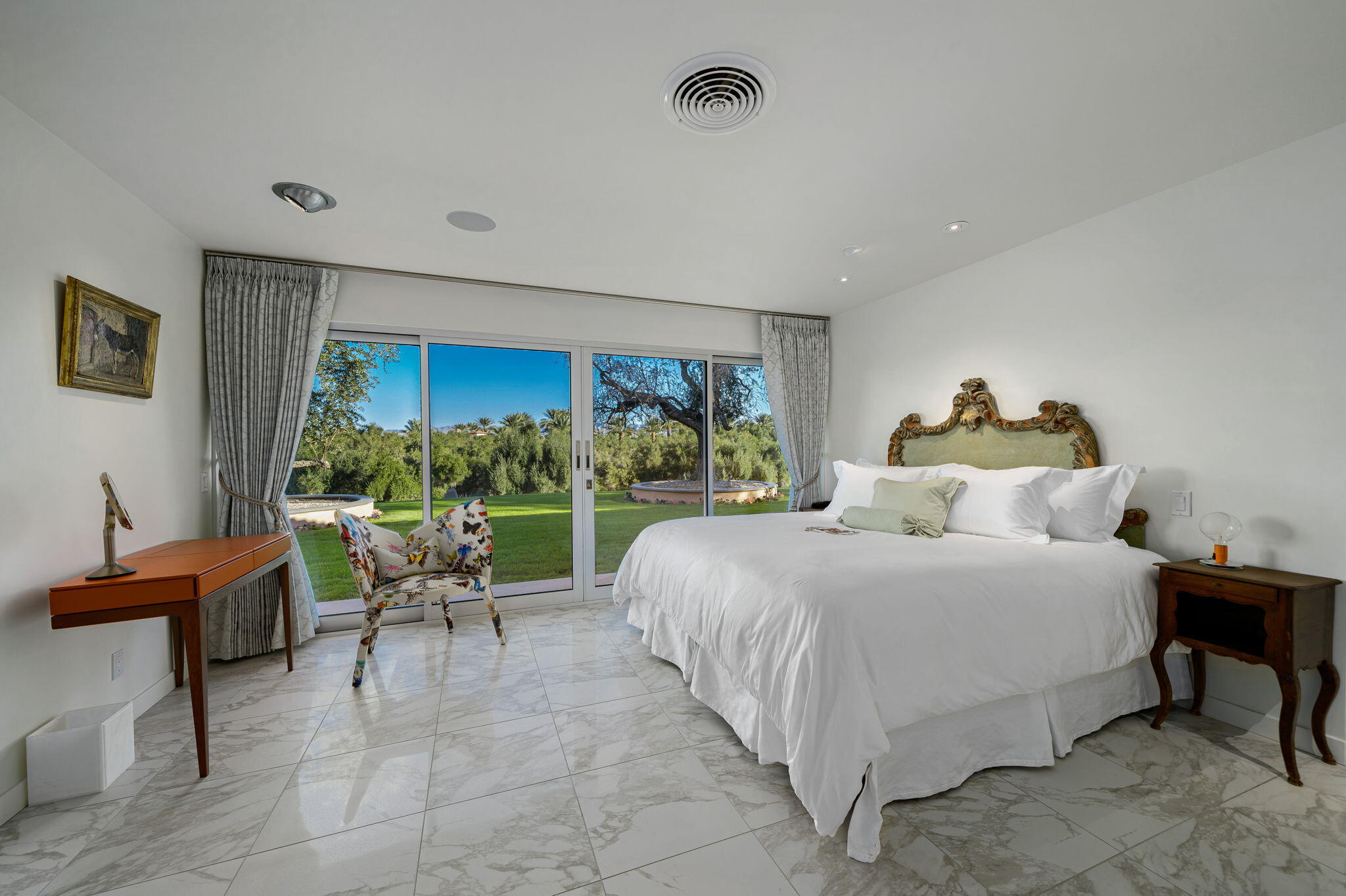 51555 Madison Street La Quinta, CA 92253 - Photo 16 of 25 a bedroom with a bed and a couch