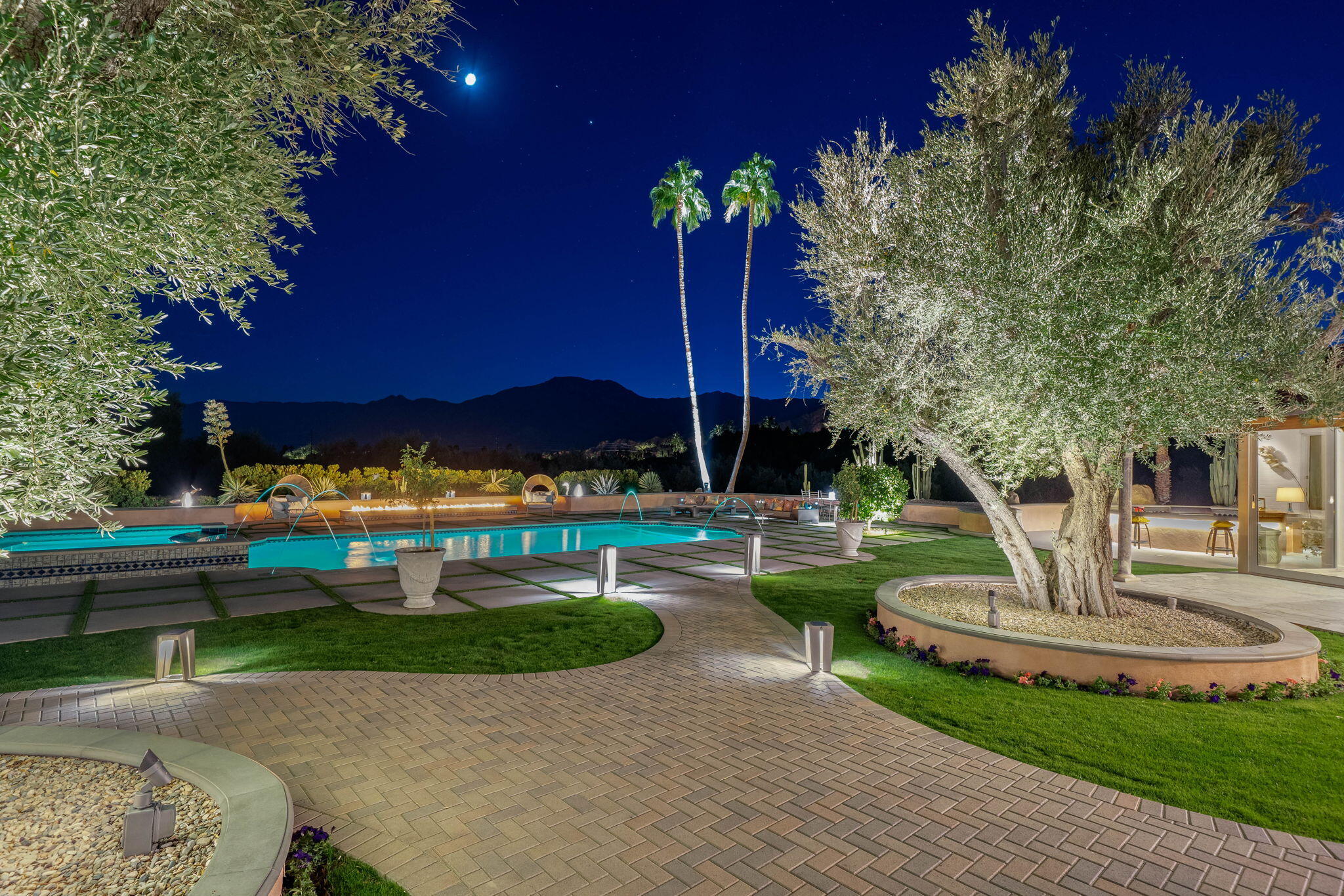 51555 Madison Street La Quinta, CA 92253 - Photo 22 of 25 a garden with trees in front of it