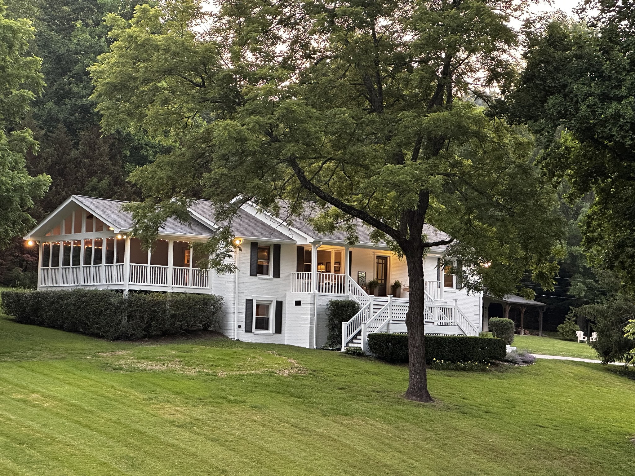 a front view of a house with a garden