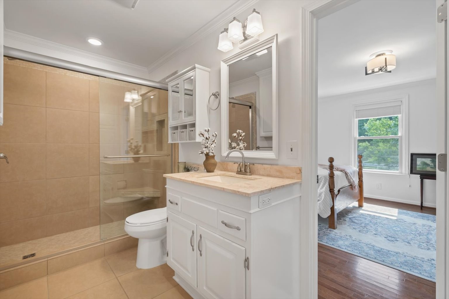 775 High Point Ridge Road Franklin, TN 37069 - Photo 16 of 41 a spacious bathroom with a granite countertop sink a toilet a mirror and shower