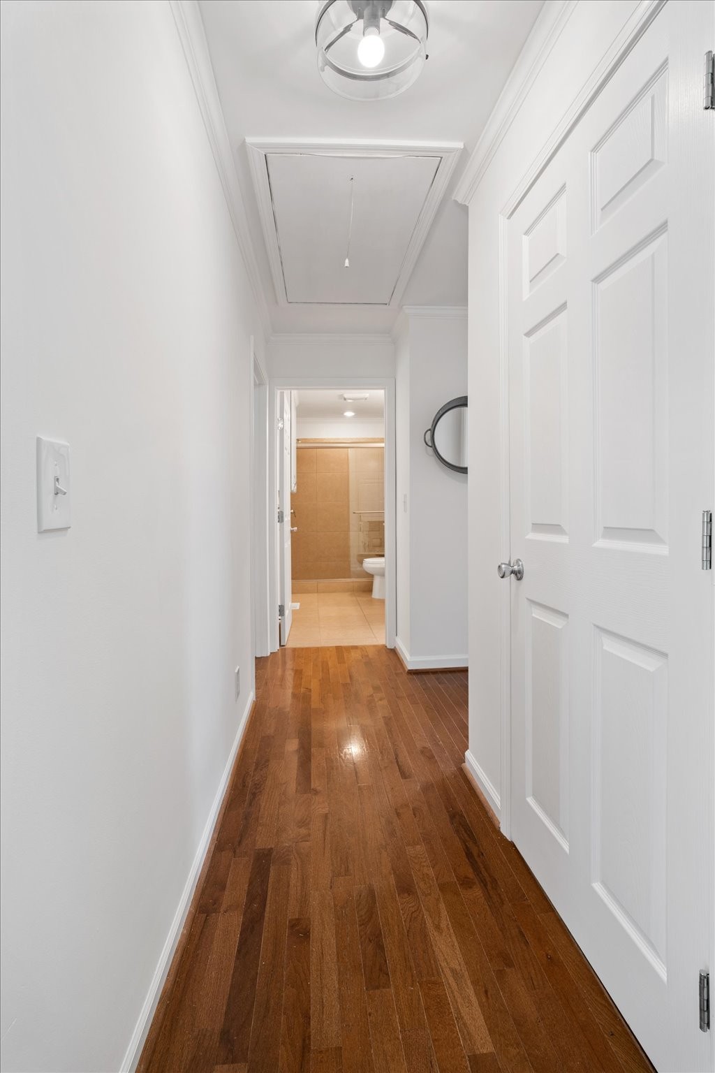 775 High Point Ridge Road Franklin, TN 37069 - Photo 20 of 41 a view of a hallway with wooden floor and a bathroom