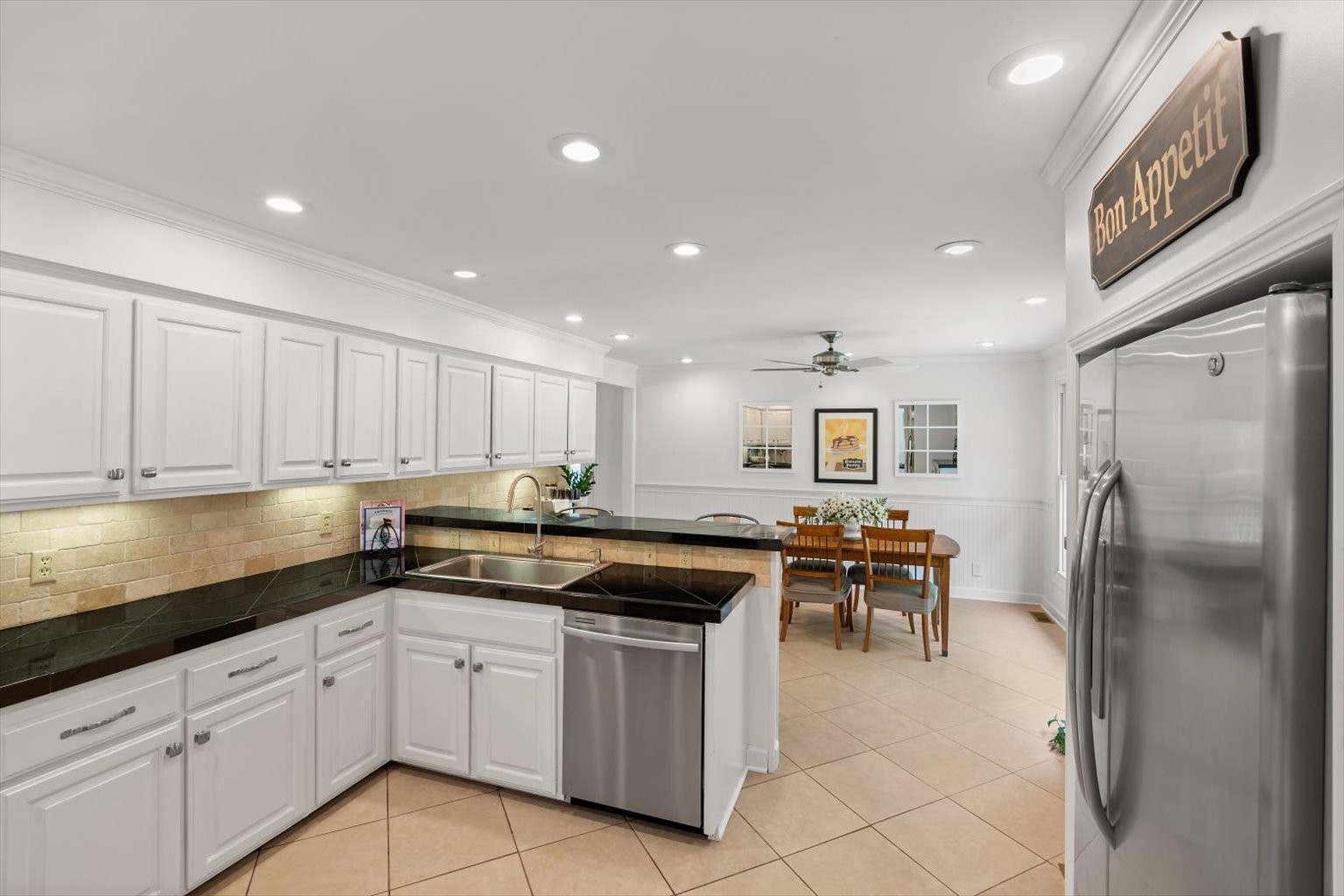 775 High Point Ridge Road Franklin, TN 37069 - Photo 23 of 41 a kitchen with granite countertop cabinets and refrigerator