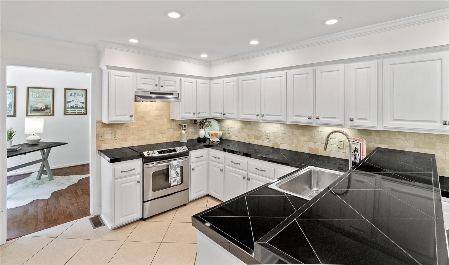 775 High Point Ridge Road Franklin, TN 37069 - Photo 25 of 41 a kitchen with granite countertop a stove sink and cabinets