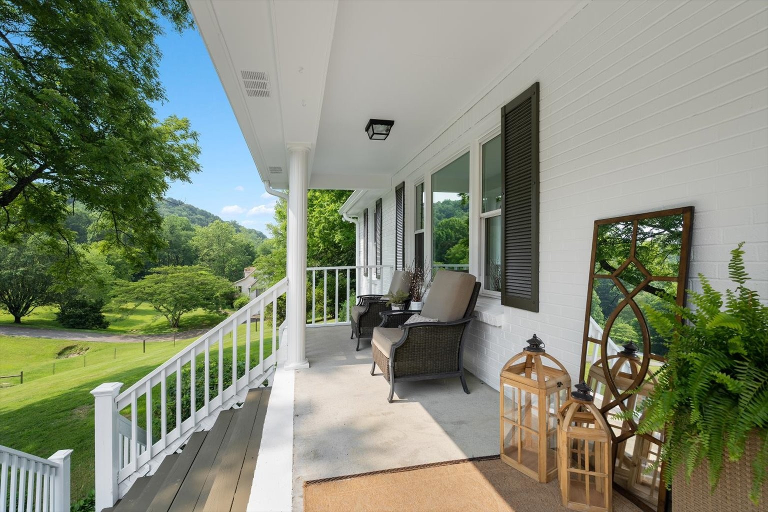 775 High Point Ridge Road Franklin, TN 37069 - Photo 4 of 41 a balcony with wooden floor and outdoor seating