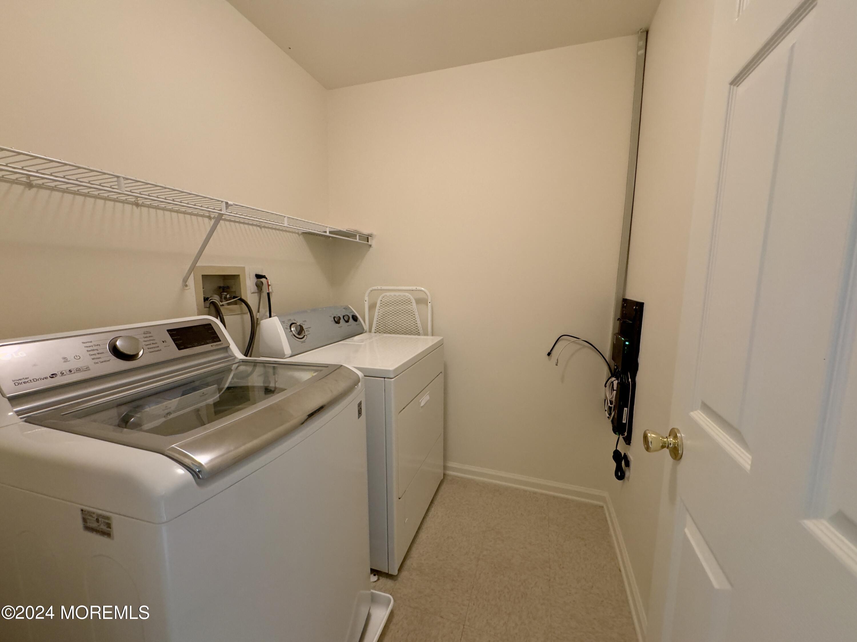 28 Alpine Road, Unit 177 Holmdel, NJ 07733 - Photo 15 of 17 a utility room with dryer and washer