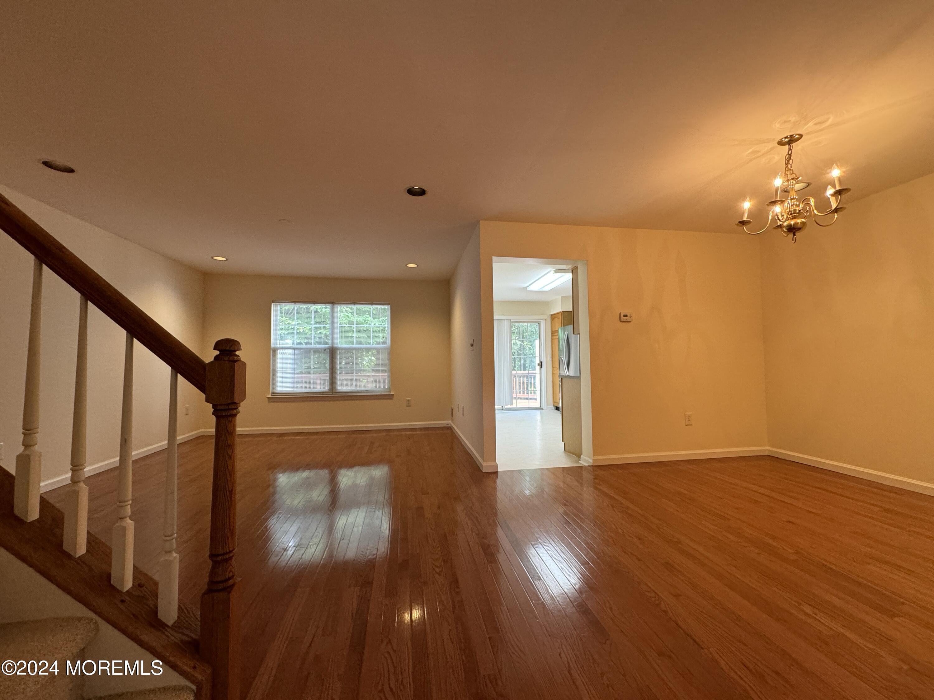 28 Alpine Road, Unit 177 Holmdel, NJ 07733 - Photo 2 of 17 a view of empty room with wooden floor