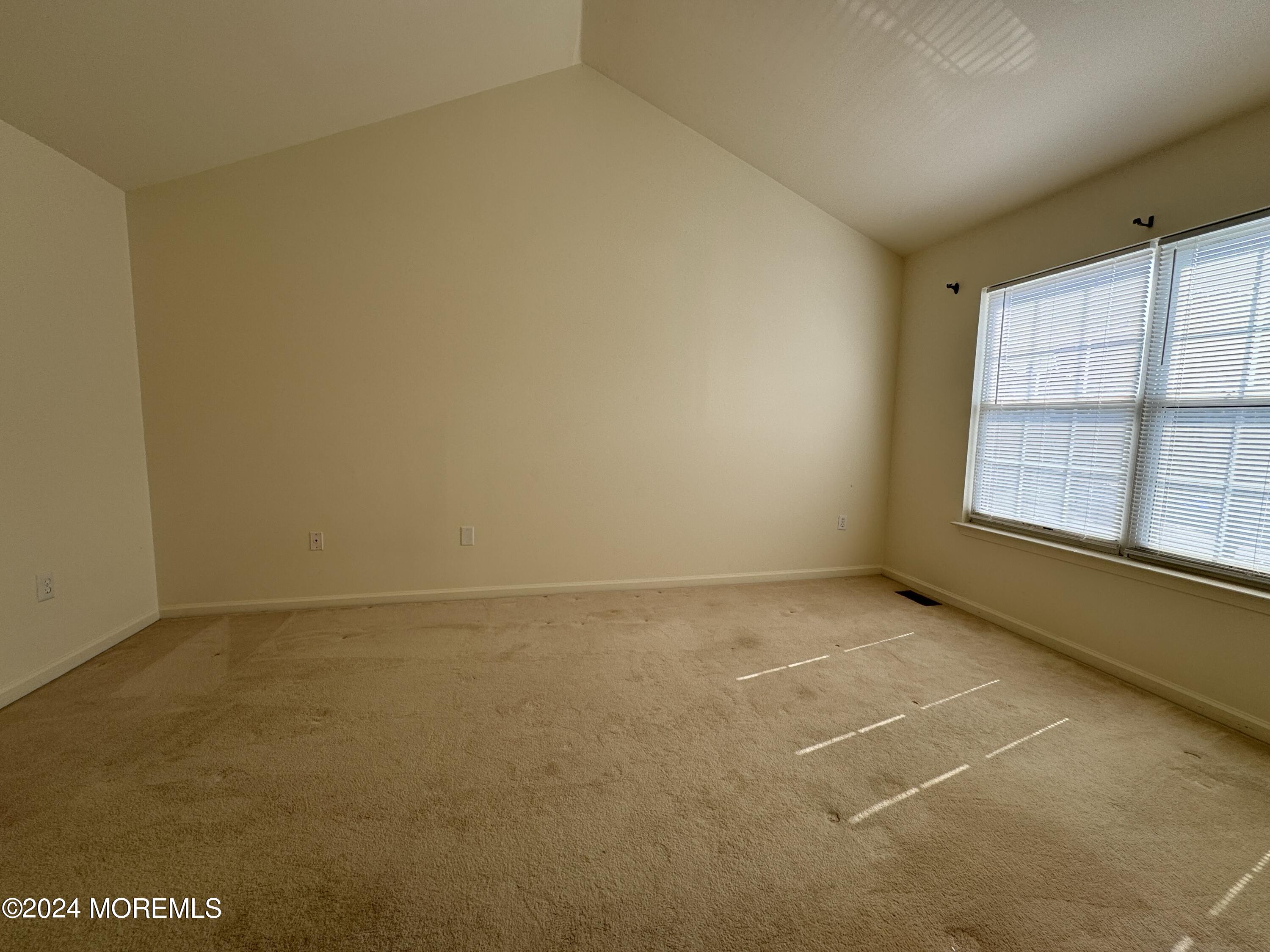 28 Alpine Road, Unit 177 Holmdel, NJ 07733 - Photo 10 of 17 a view of an empty room with a window