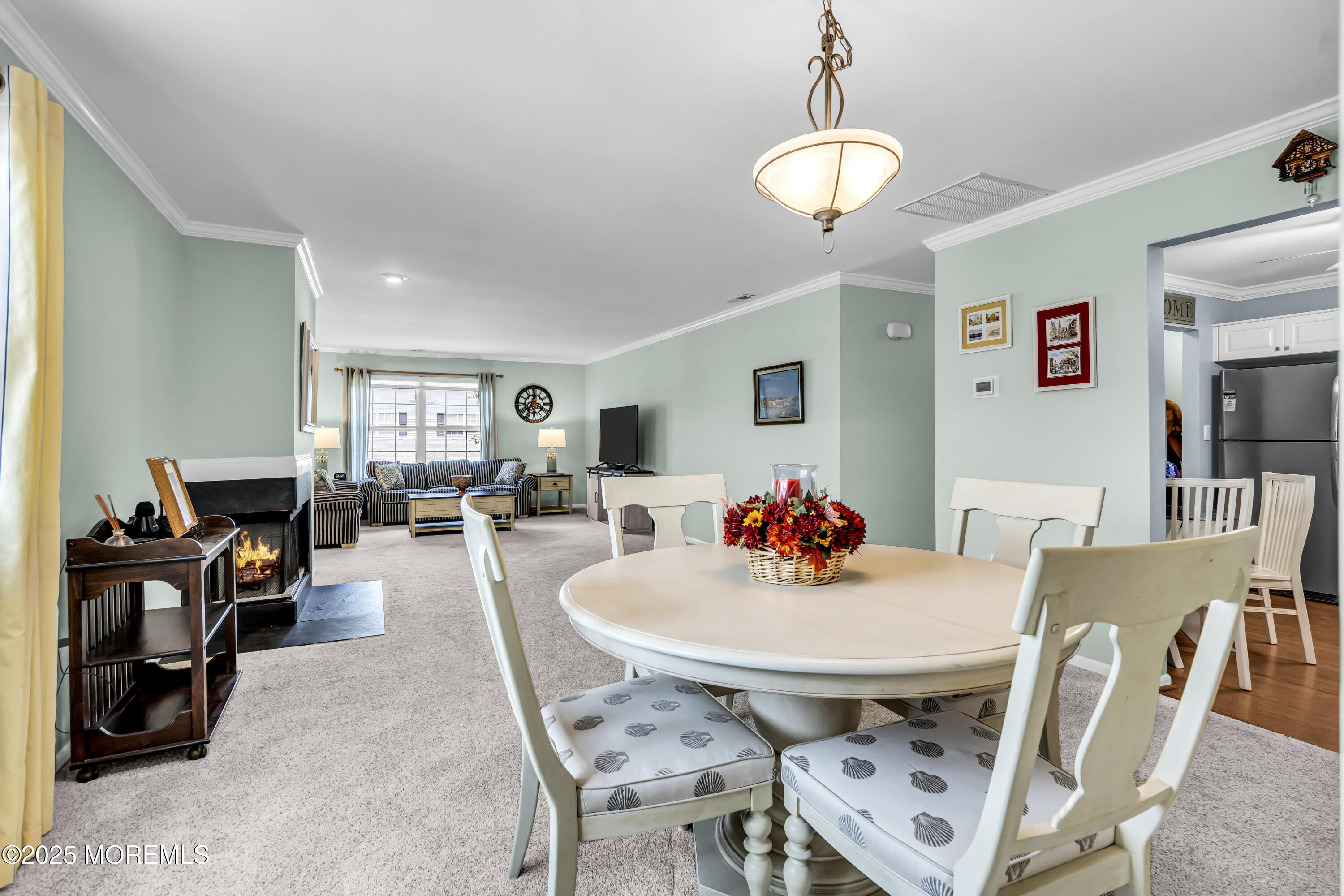 32 Racquet Road Wall, NJ 07719 - Photo 13 of 23 a view of a dining room with furniture and a chandelier