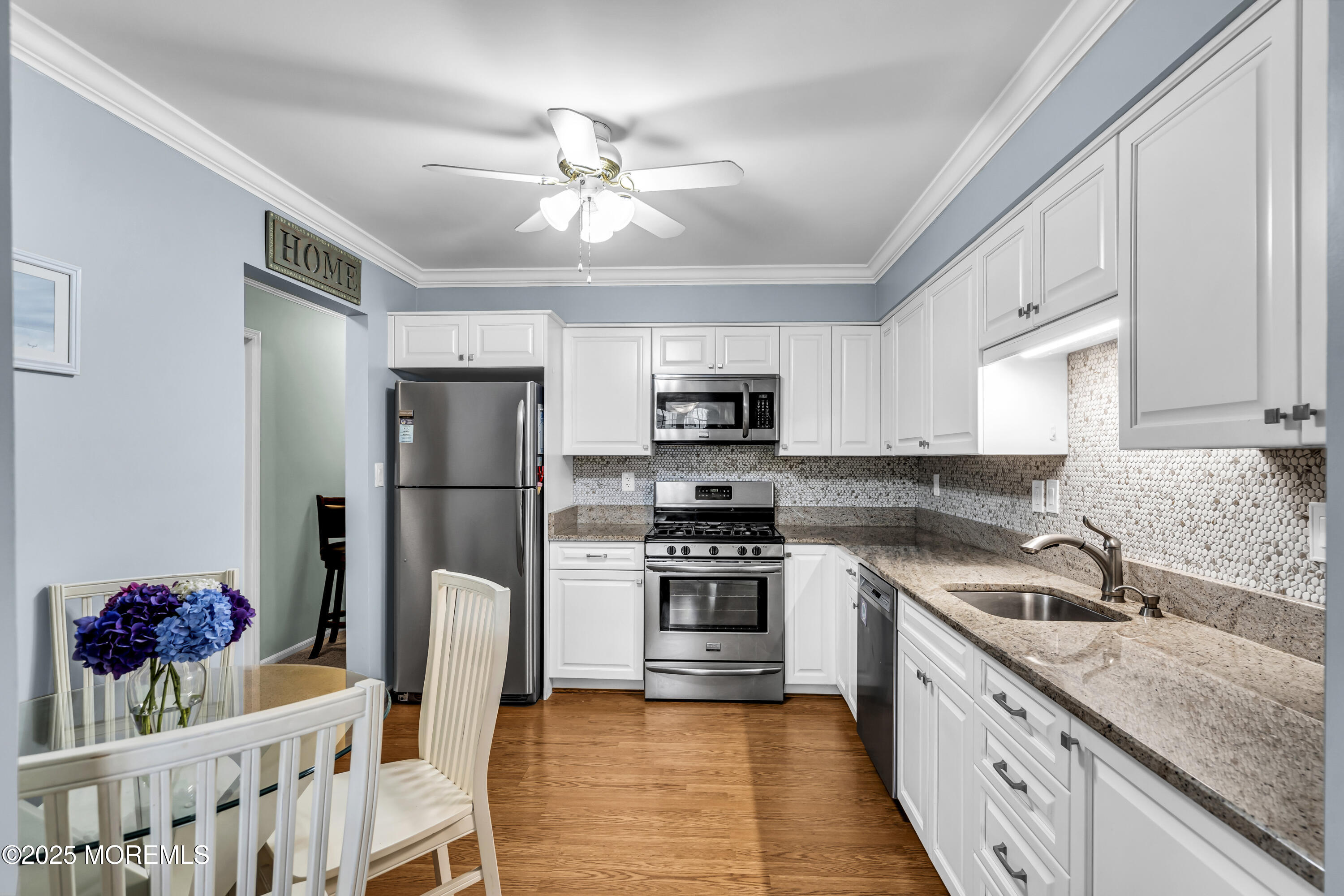 32 Racquet Road Wall, NJ 07719 - Photo 14 of 23 a kitchen with stainless steel appliances granite countertop a sink refrigerator and cabinets