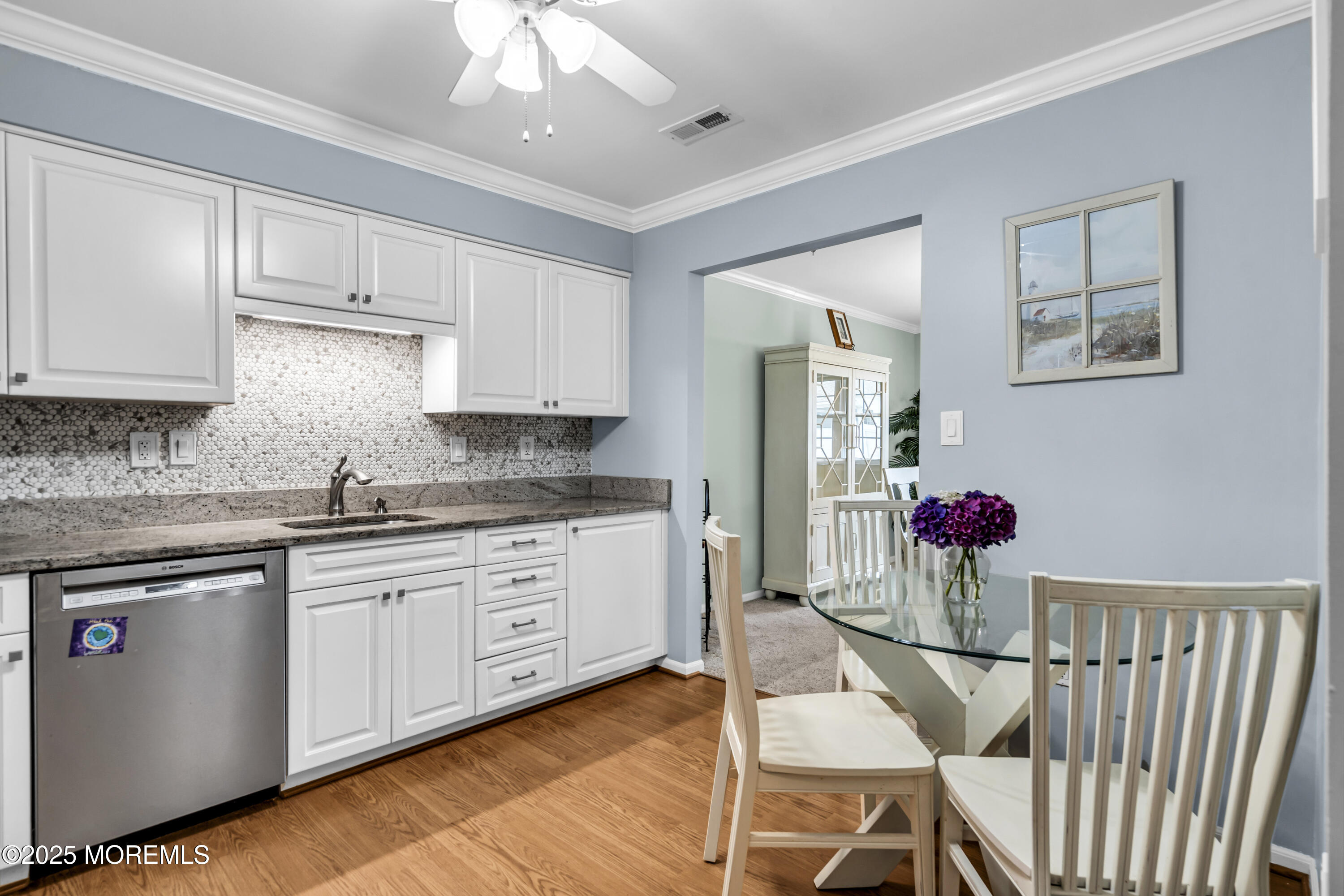 32 Racquet Road Wall, NJ 07719 - Photo 15 of 23 a kitchen with stainless steel appliances granite countertop a cabinets sink and wooden floor