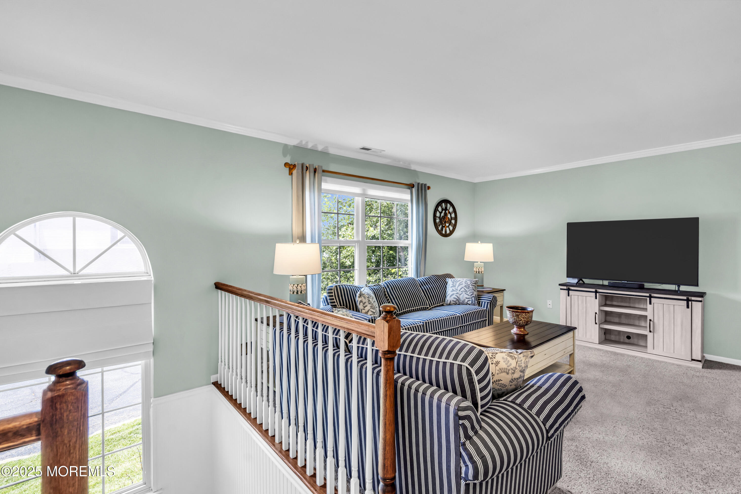 32 Racquet Road Wall, NJ 07719 - Photo 7 of 23 a bedroom with furniture a flat screen tv and a window