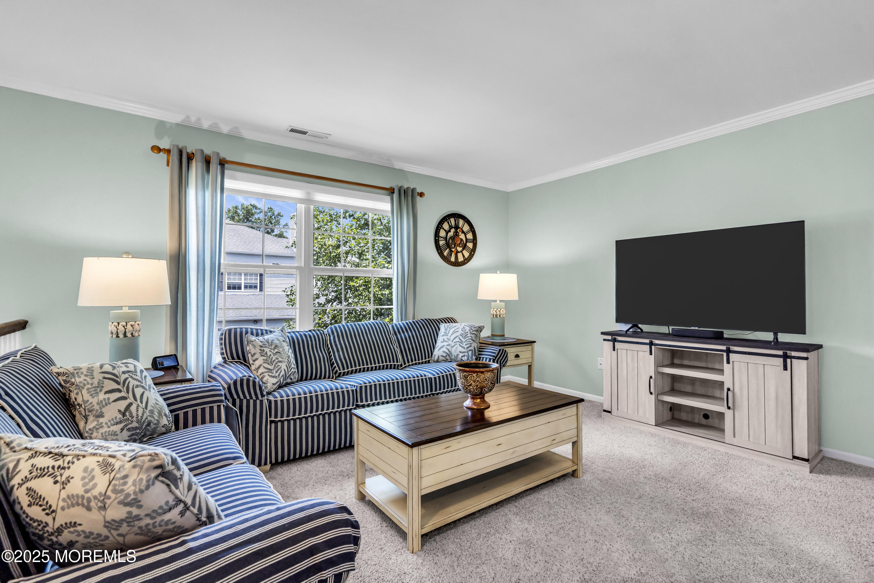 32 Racquet Road Wall, NJ 07719 - Photo 8 of 23 a living room with furniture and a flat screen tv