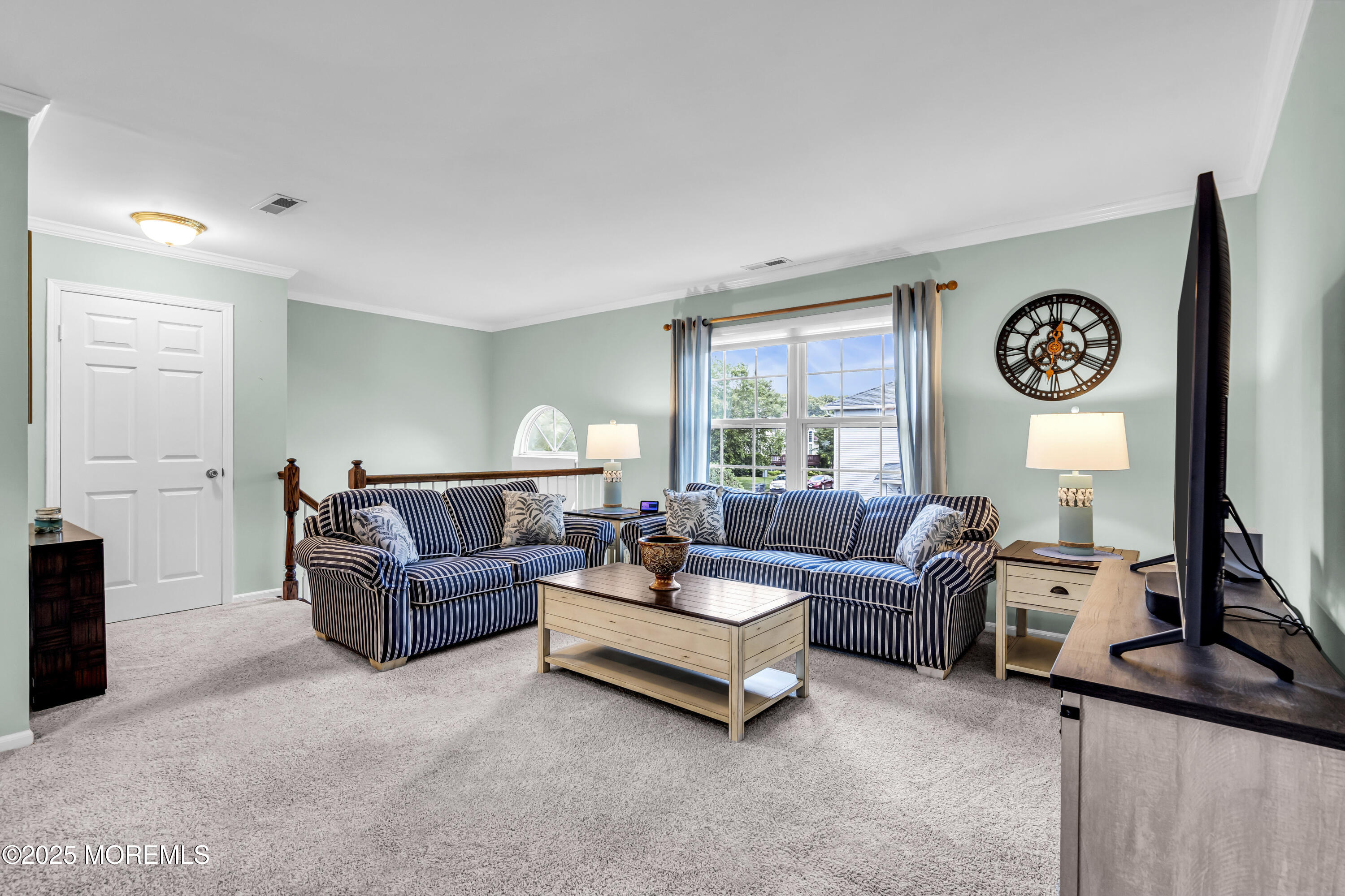 32 Racquet Road Wall, NJ 07719 - Photo 9 of 23 a living room with fireplace furniture and a large window