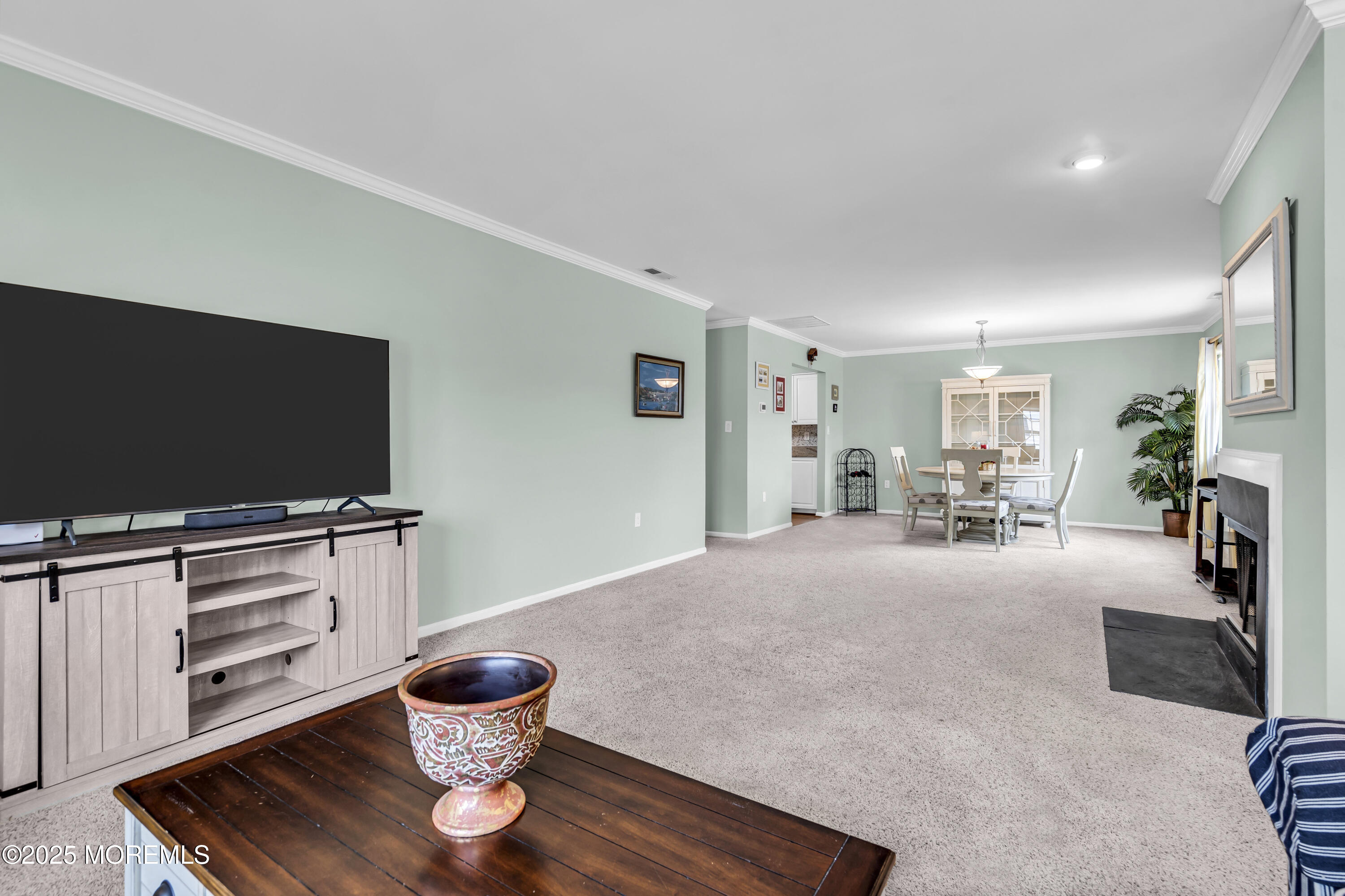 32 Racquet Road Wall, NJ 07719 - Photo 10 of 23 a living room with furniture and a flat screen tv