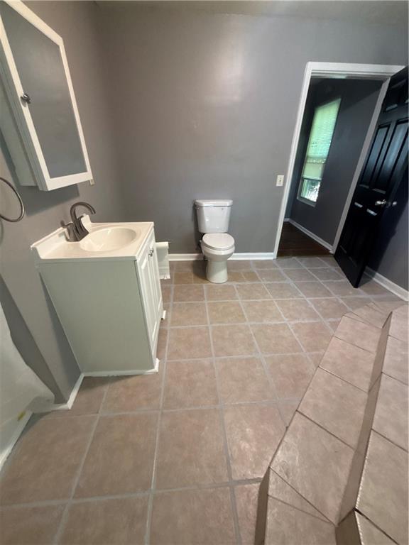 335 Cedarhurst Street Pittsburgh, PA 15210 - Photo 8 of 28 a bathroom with a sink and a mirror