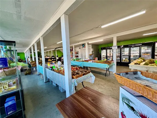 a room with musical instrument pool table and windows