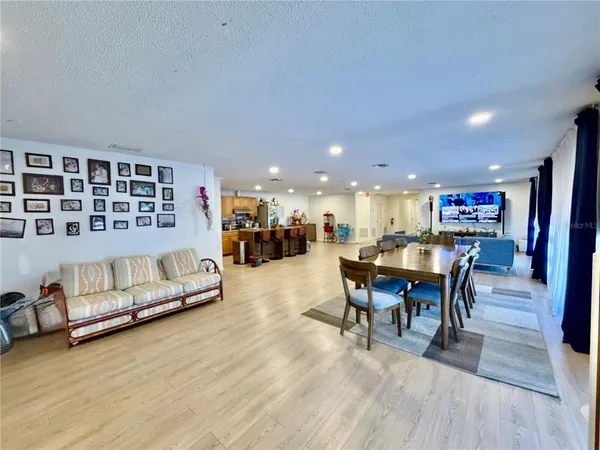 a view of a room with wooden floor