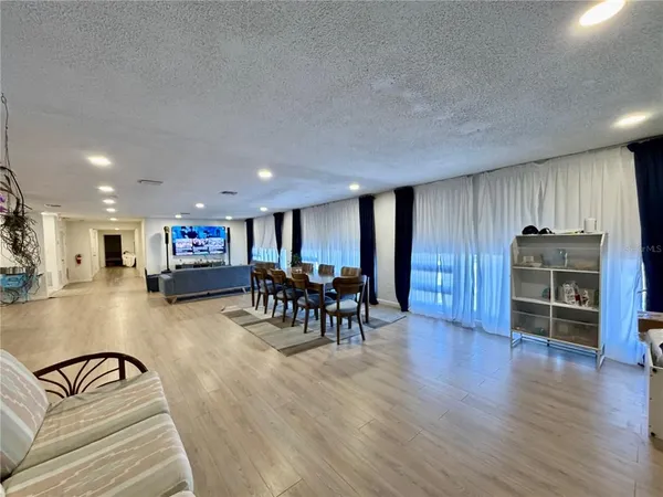 a bedroom with a bed and a mirror