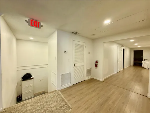 a spacious bathroom with a double vanity sink mirror and a bathtub