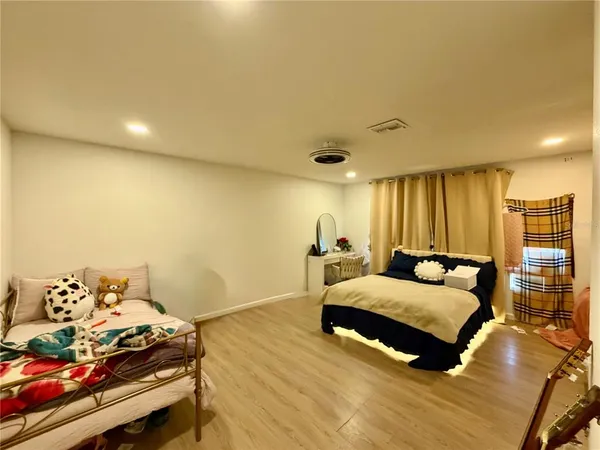 a bathroom with a double vanity sink mirror and toilet