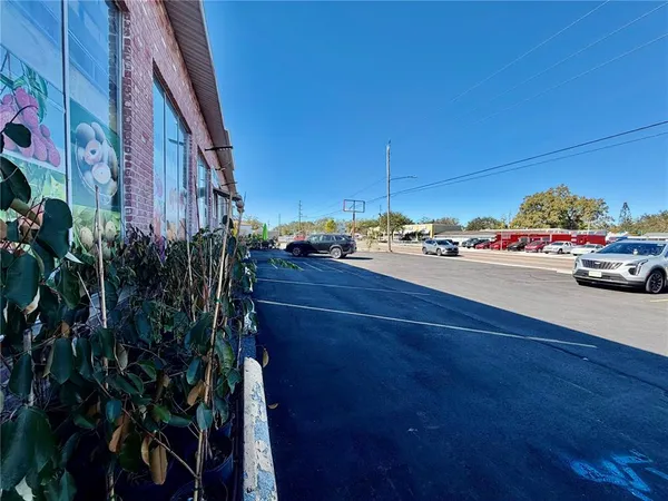 a view of a city street with cars